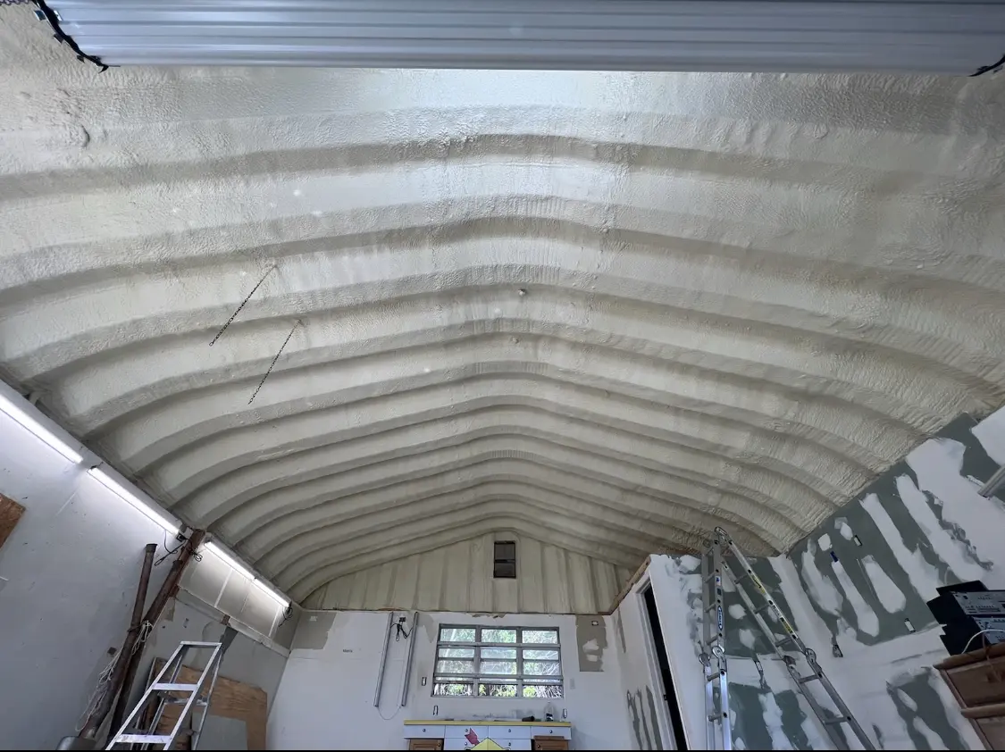 Spray polyurethane foam applied to the underside of a metal roof deck in Satellite Beach